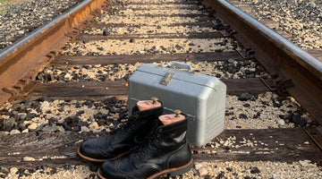 A Pair of Brogue Red Wing Boots and a Fishing Tackle Box