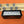 Load image into Gallery viewer, DOMINOES CORONA EXTRA WITH 2 WOOD HOLDERS- BLACK

