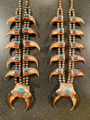 Pair of his and hers Vintage Navajo Pawn sterling Turquoise/Coral Squash blossoms with claws