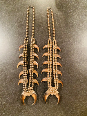 Pair of his and hers Vintage Navajo Pawn sterling Turquoise/Coral Squash blossoms with claws