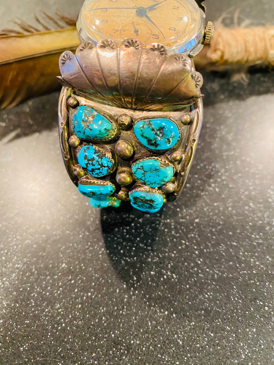 Navajo Pawn Turquoise Silver watch Cuff paired with a vintage authentic Brietling watch